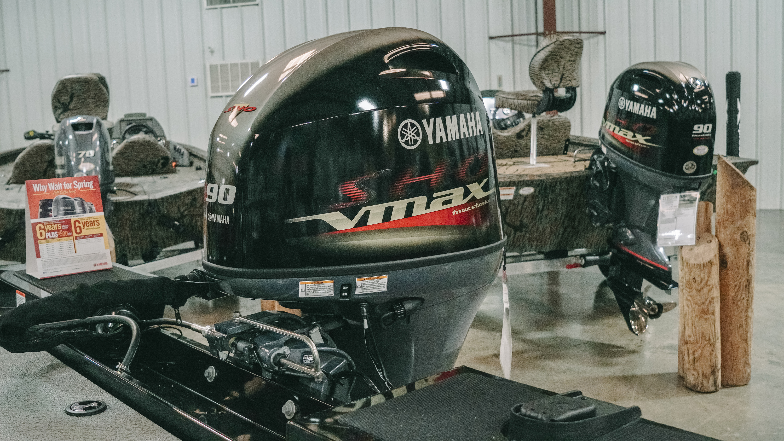 Two Yamaha® outboard motors being serviced in a shop