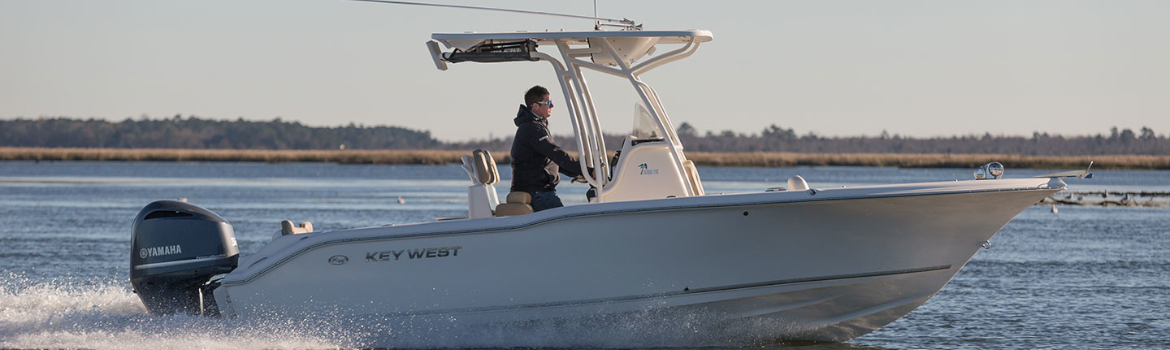 Man cruising down open water on a Key West boat